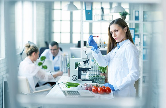Female scientist in food science lab.