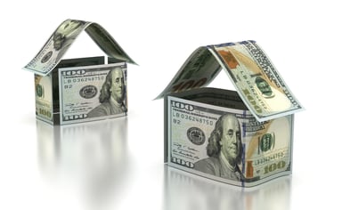 Two houses built out of $100 bills