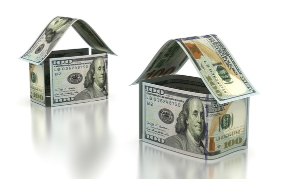 Two houses built out of $100 bills