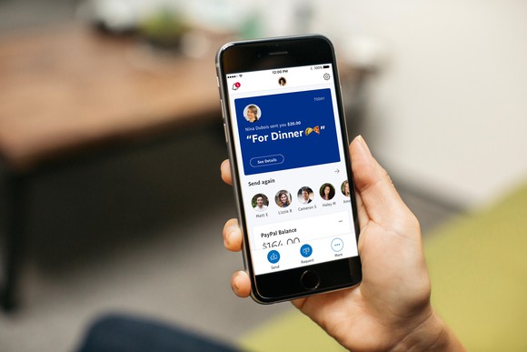 Person using Paypal from his smartphone.