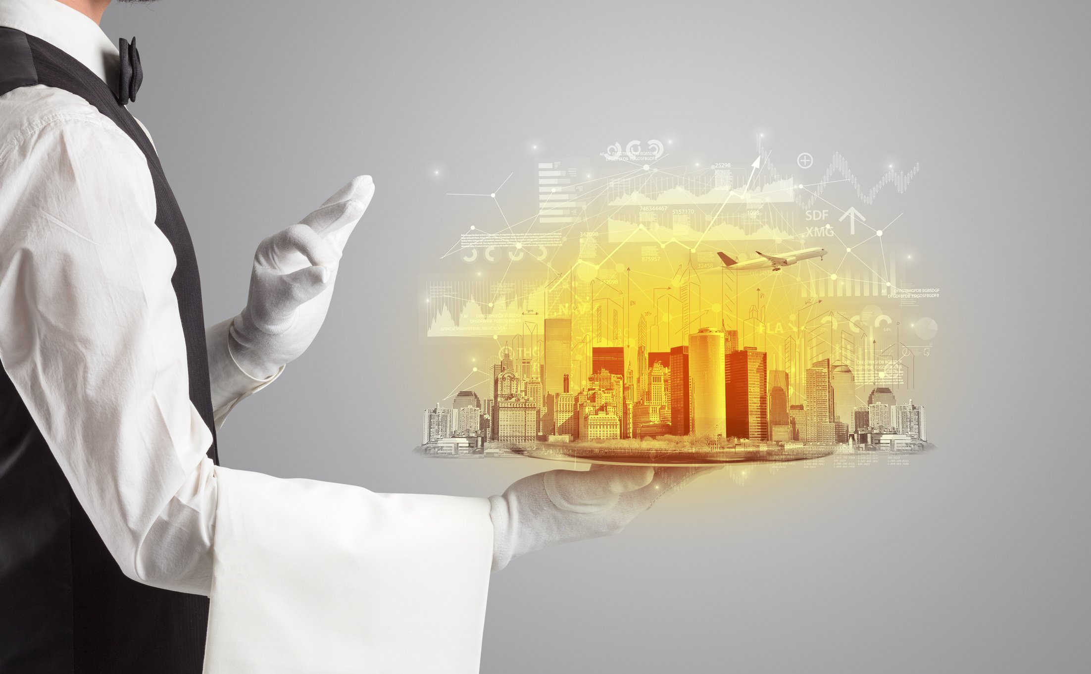 Waiter serving up a city on a platter