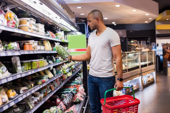 A man grocery shopping.