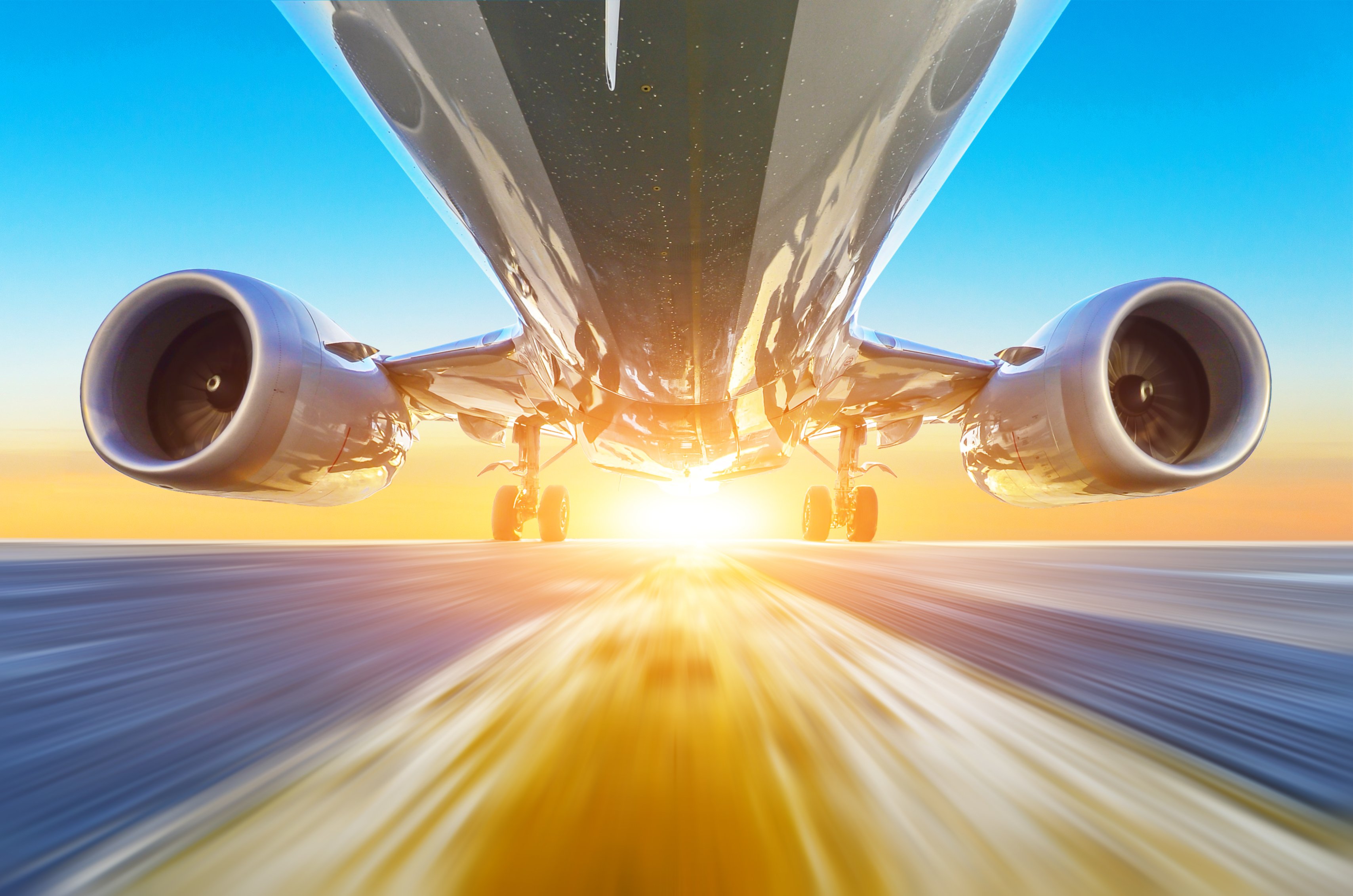 View from below of the high-speed acceleration of a commercial aircraft. 