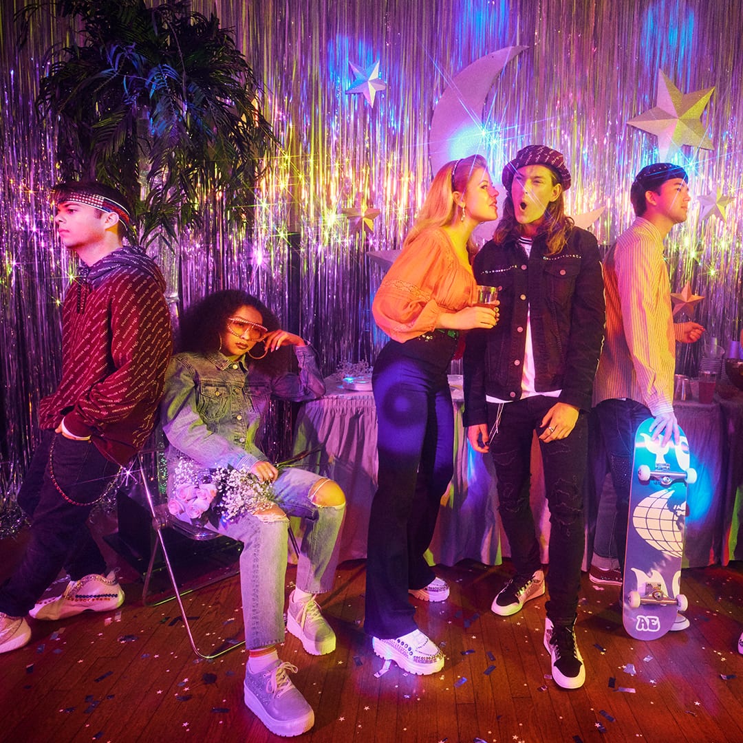 Teens wearing American Eagle Outfitters clothing at a party.