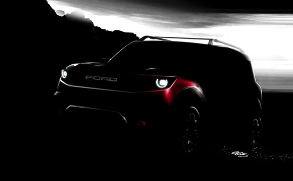 A darkened photo of a Ford Bronco Sport, a small off-road SUV.