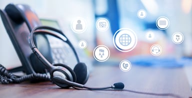 Phone and headset lying on a desk