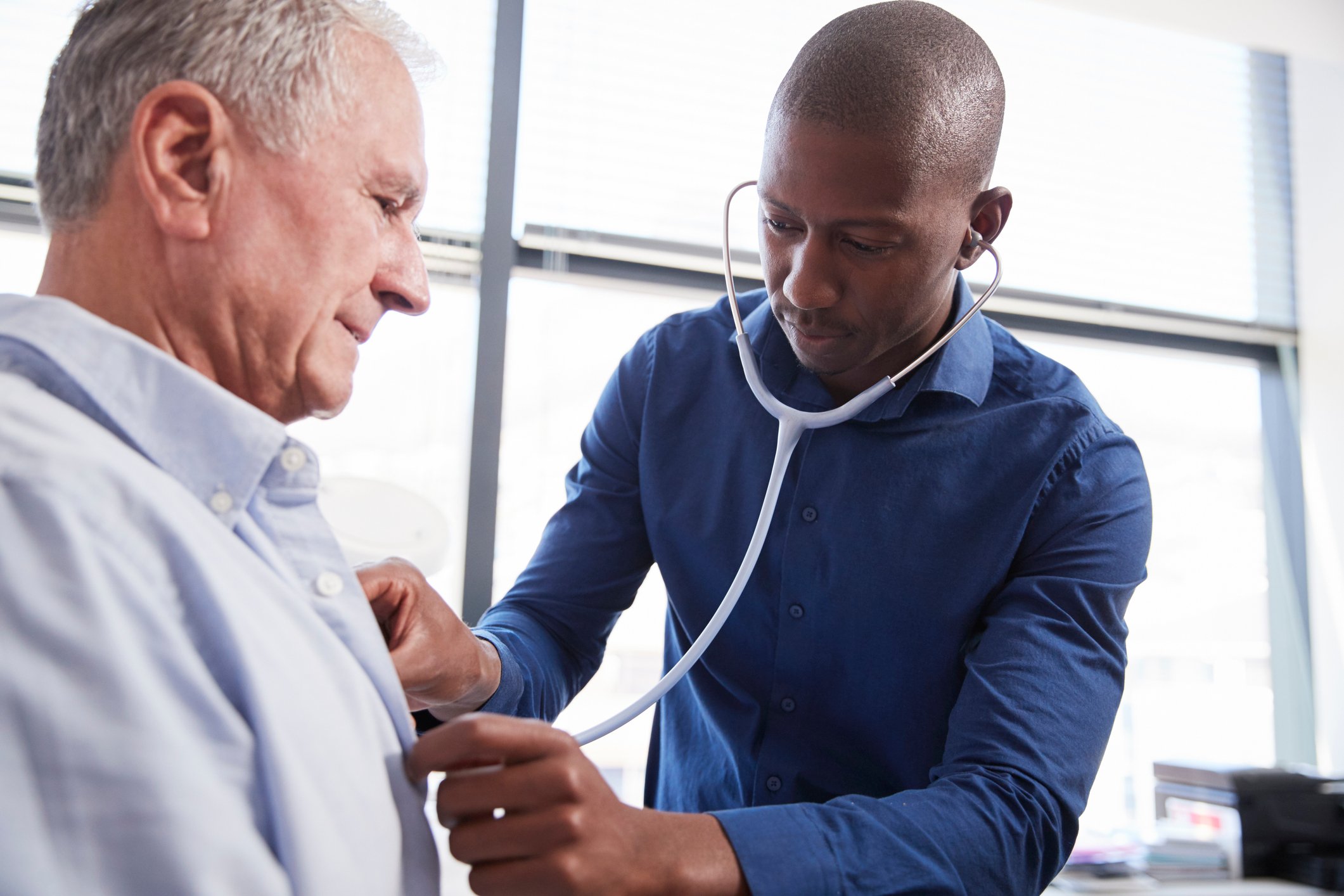 Doctor listening to a patient's heart with a stethoscope