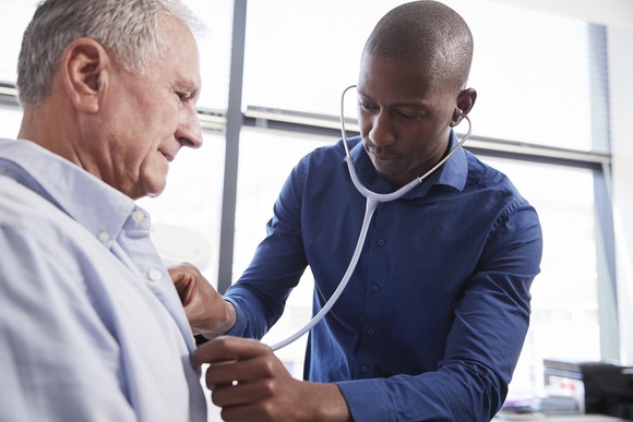 Doctor listening to a patient's heart with a stethoscope