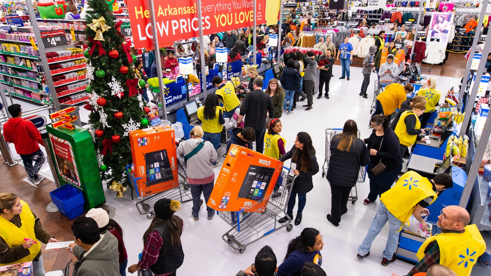 Customers shopping in a Walmart store.