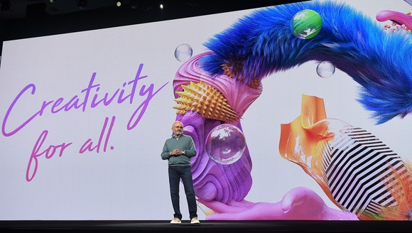 Shantanu Narayen in front of a slide that says "Creativity for all"