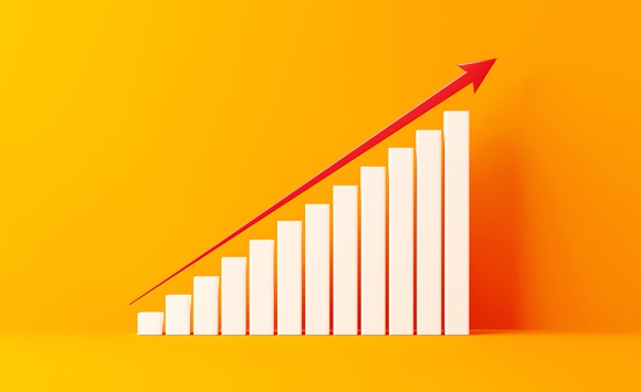 A picture of a rising bar chart on a yellow background.