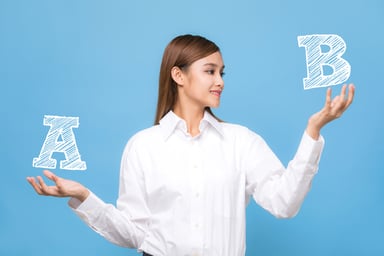 Asian woman with the letters A and B in her hands