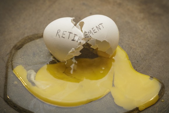 A cracked egg with the word retirement written on it. 