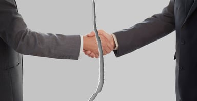 Ripped picture of businessmen shaking hands