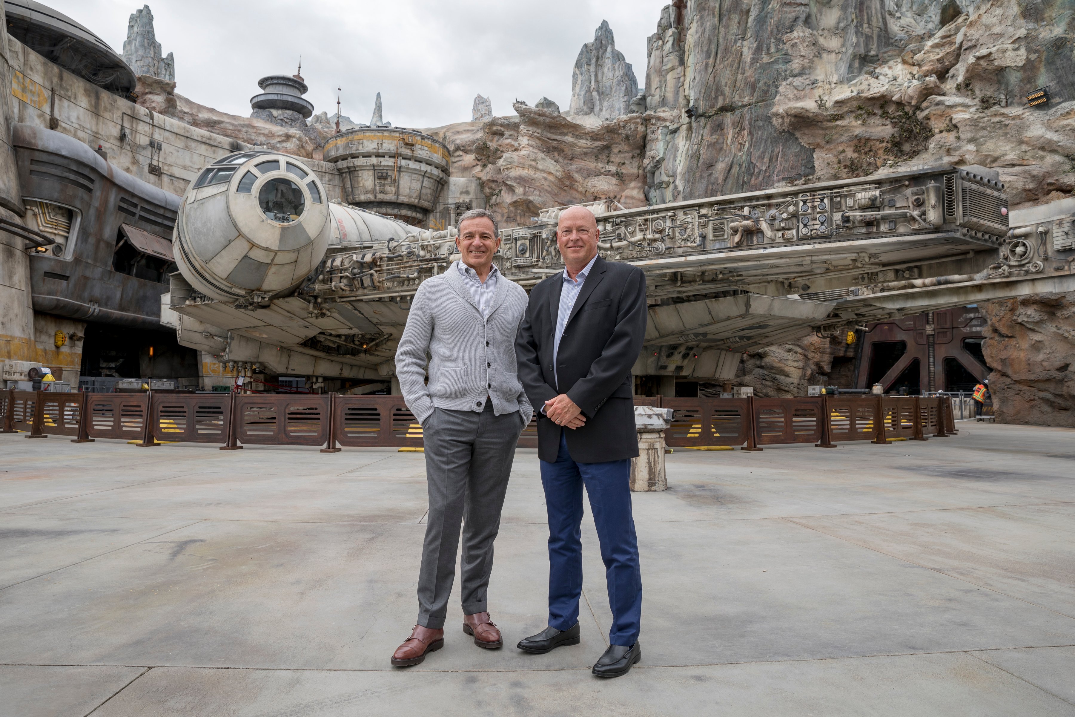Disney's Bob Iger and Bob Chapek standing in front of the Star Wars attraction at Disneyland.