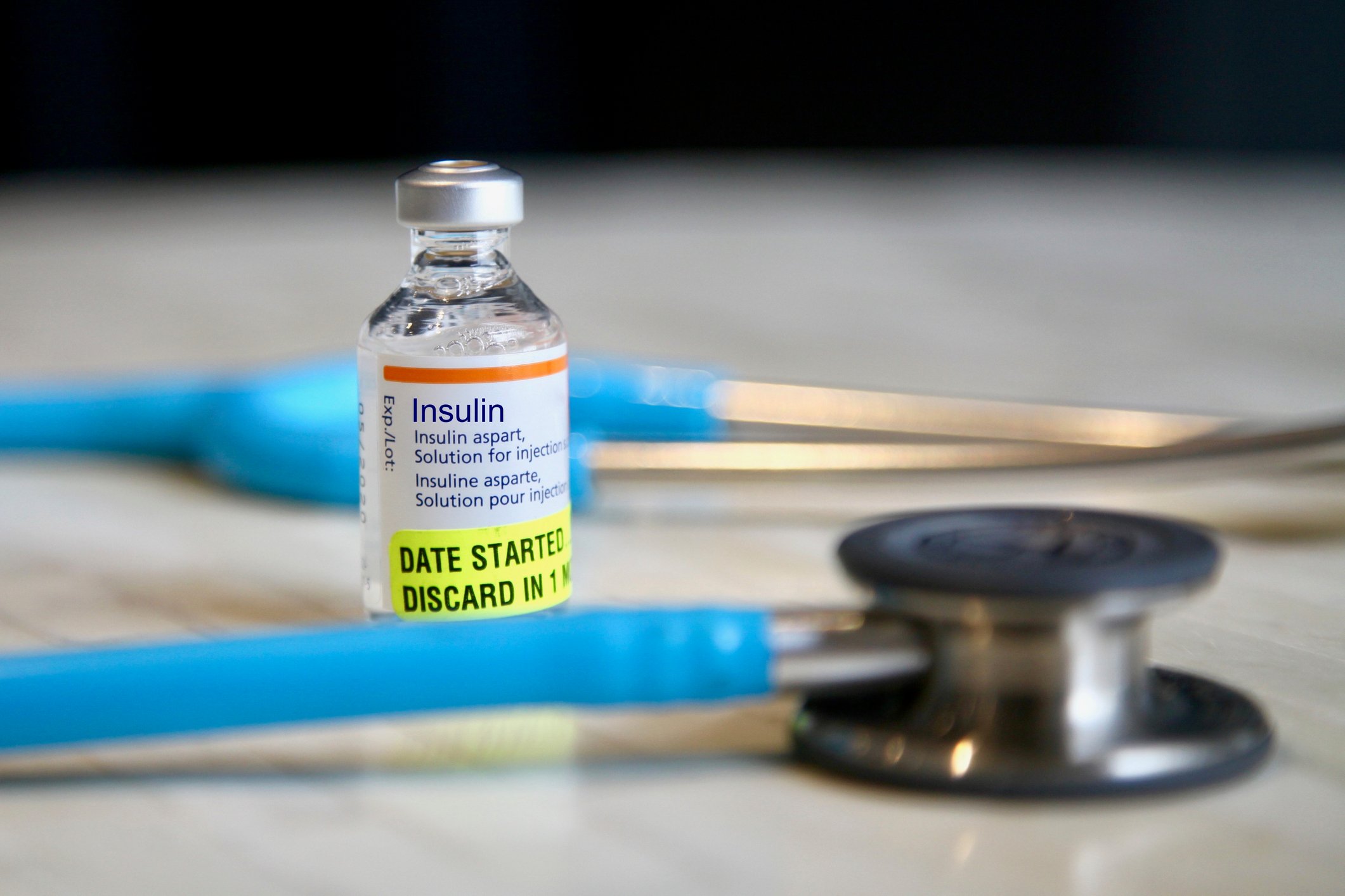 Vial of insulin with stethoscope.