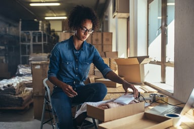 shop owner packing item box shipping