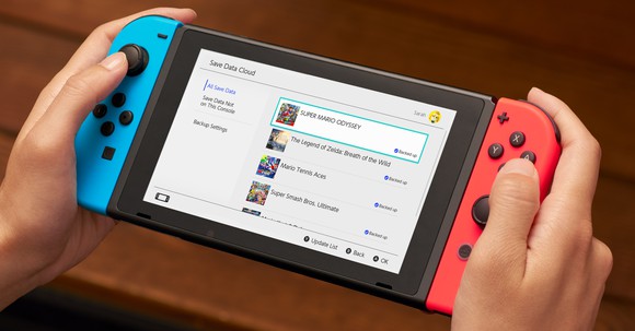 A person's hands holding a Nintendo Switch.