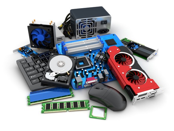 various pieces of computer equipment sit on a table