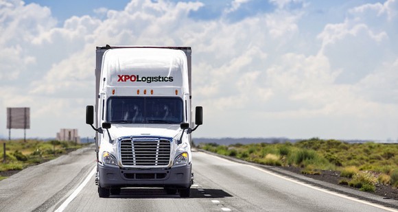 An XPO Logistics truck rolling down the highway