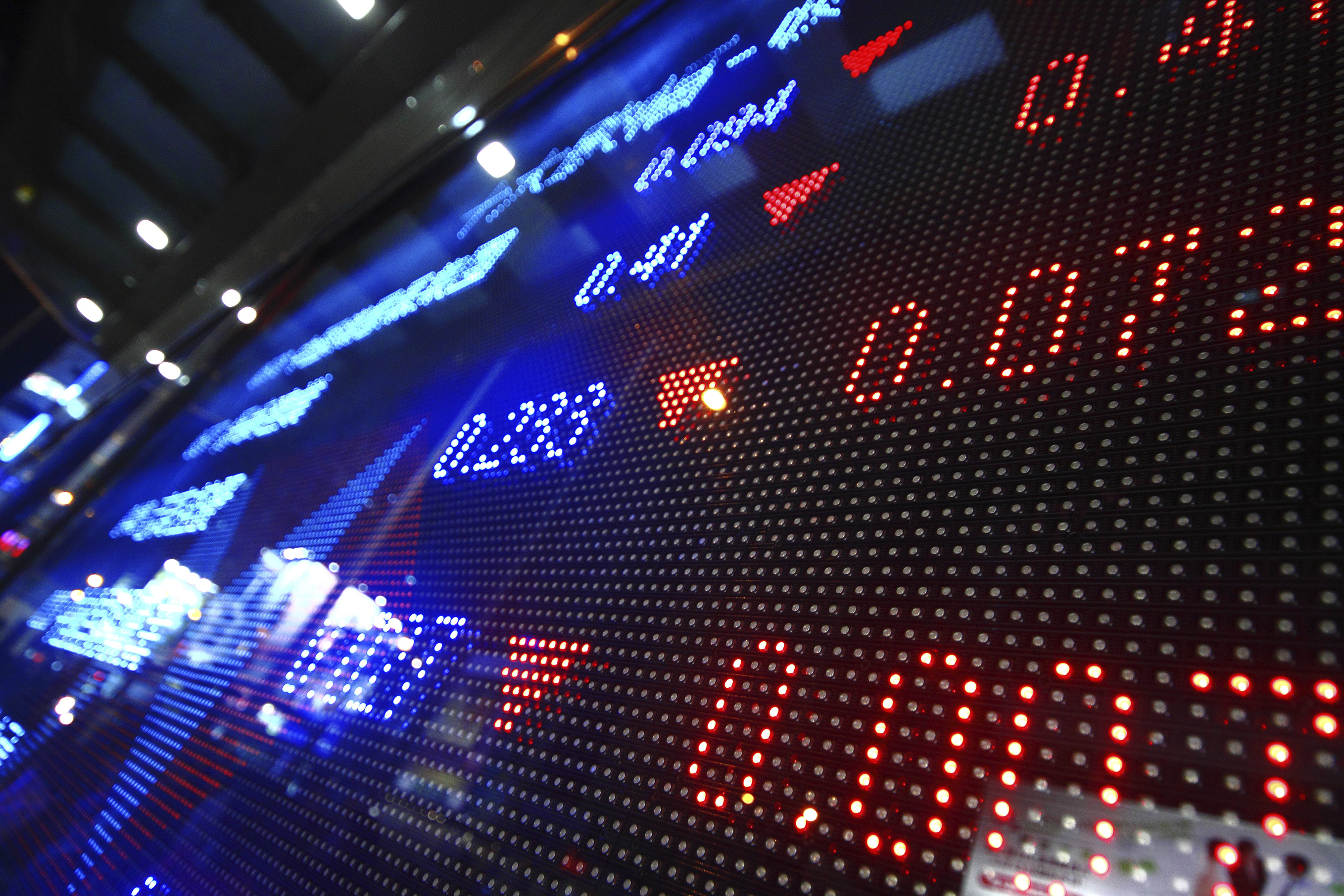 A digital display showing falling prices