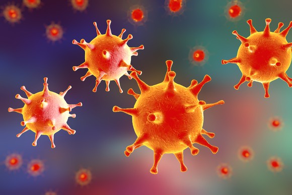 Closeup picture of multiple cytomegalovirus cells floating around.