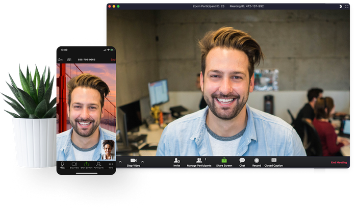 Image of a youngish casually dressed man on a computer screen and on a cell phone screen.