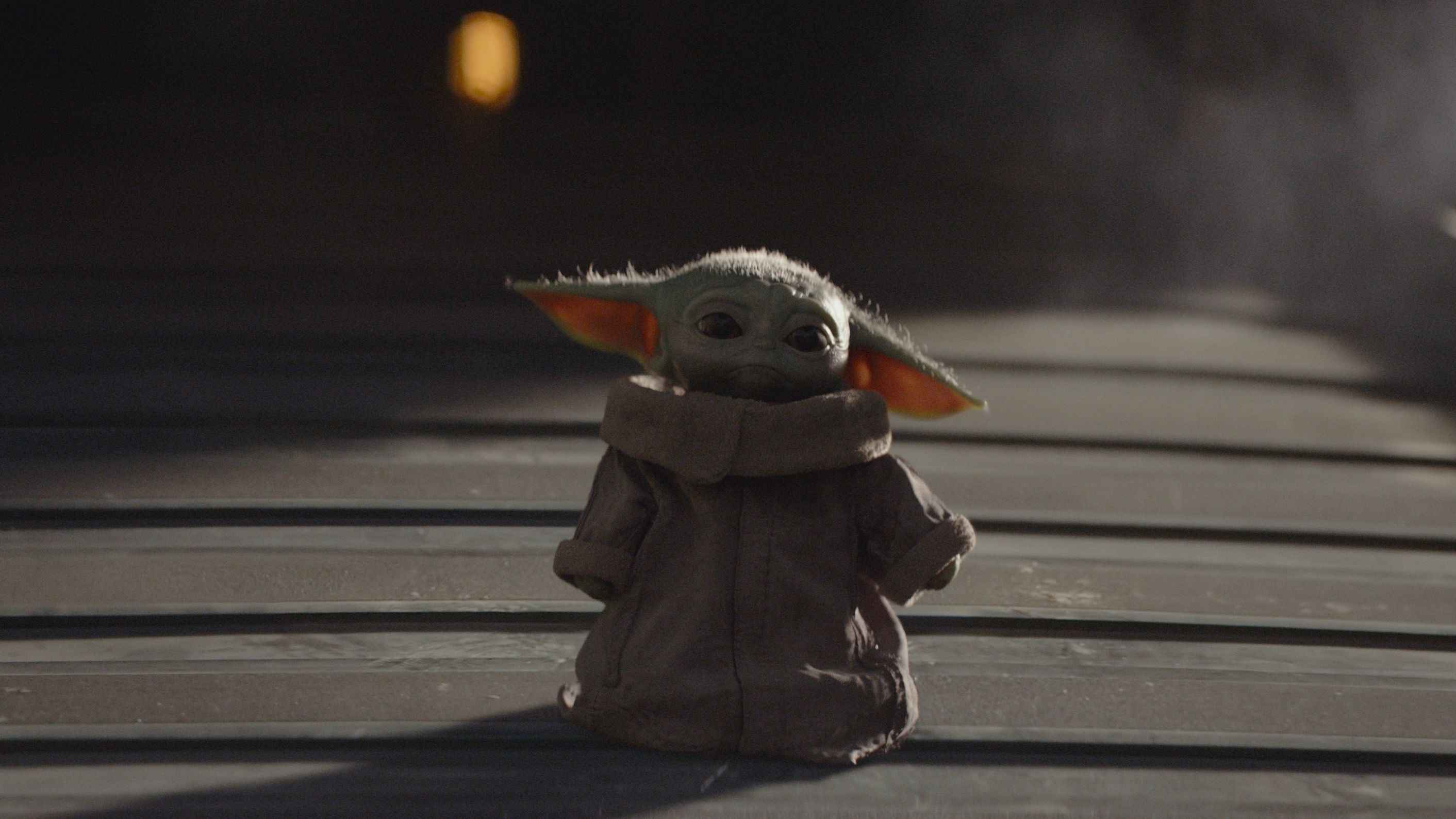A scene featuring Baby Yoda in Disney's The Mandalorian.