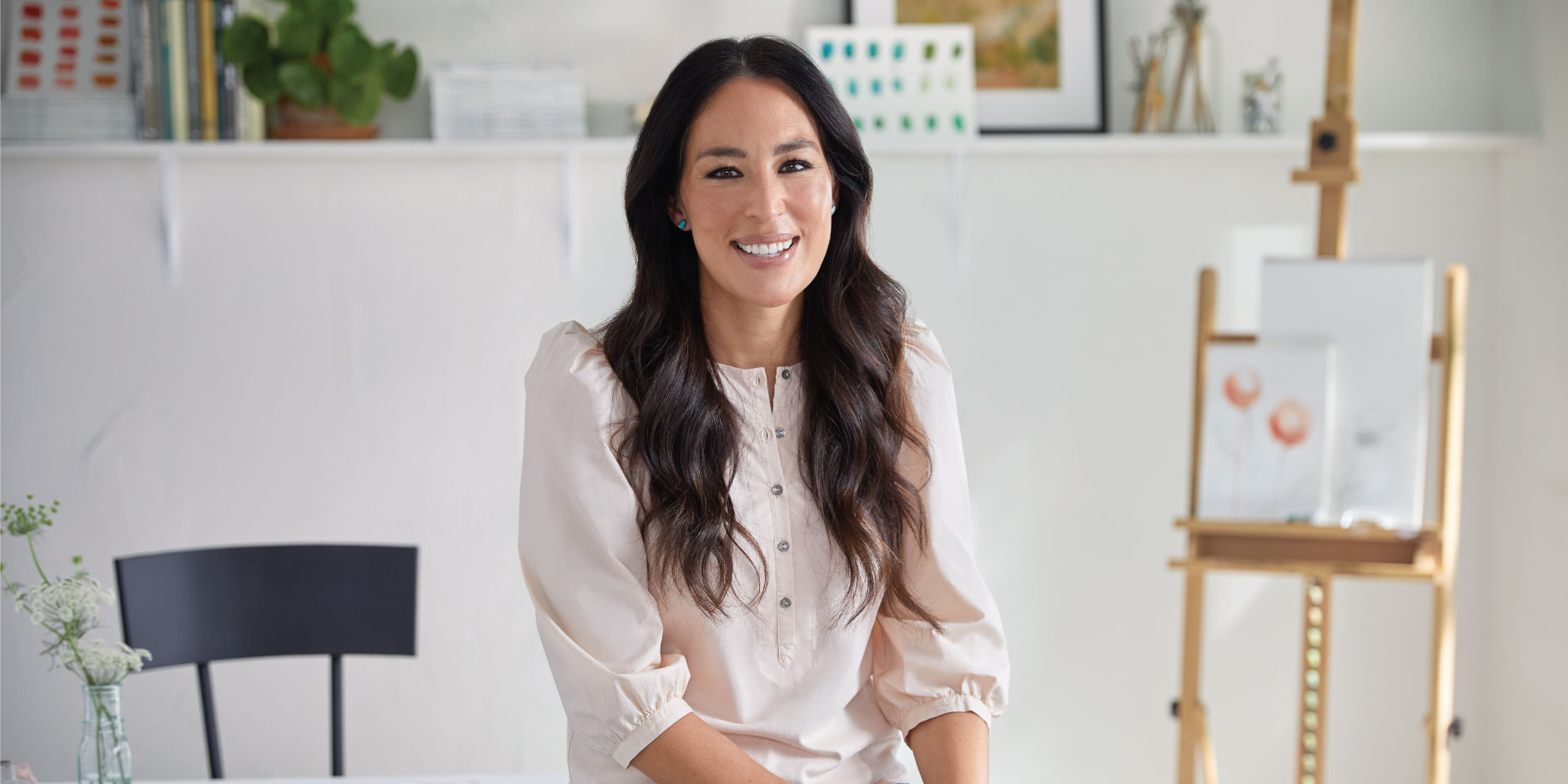 Joanna Gaines is sitting.