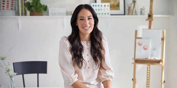 Joanna Gaines is sitting.