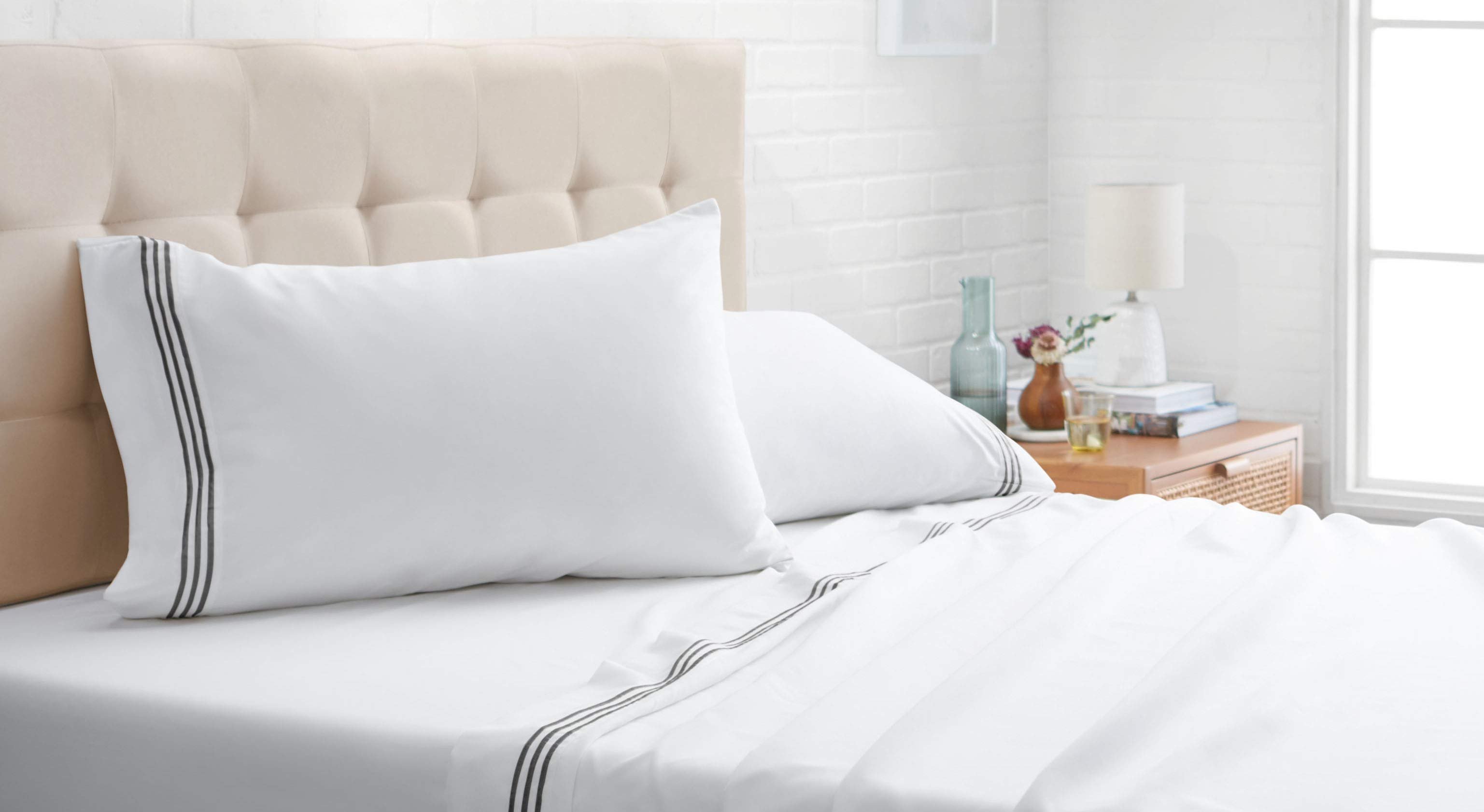 A bed is made using Amazon's bedding.