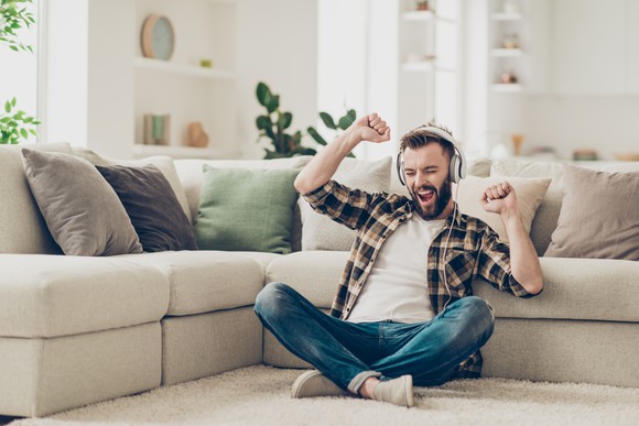 Man listening to music through headphones