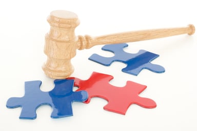 Gavel on puzzle pieces