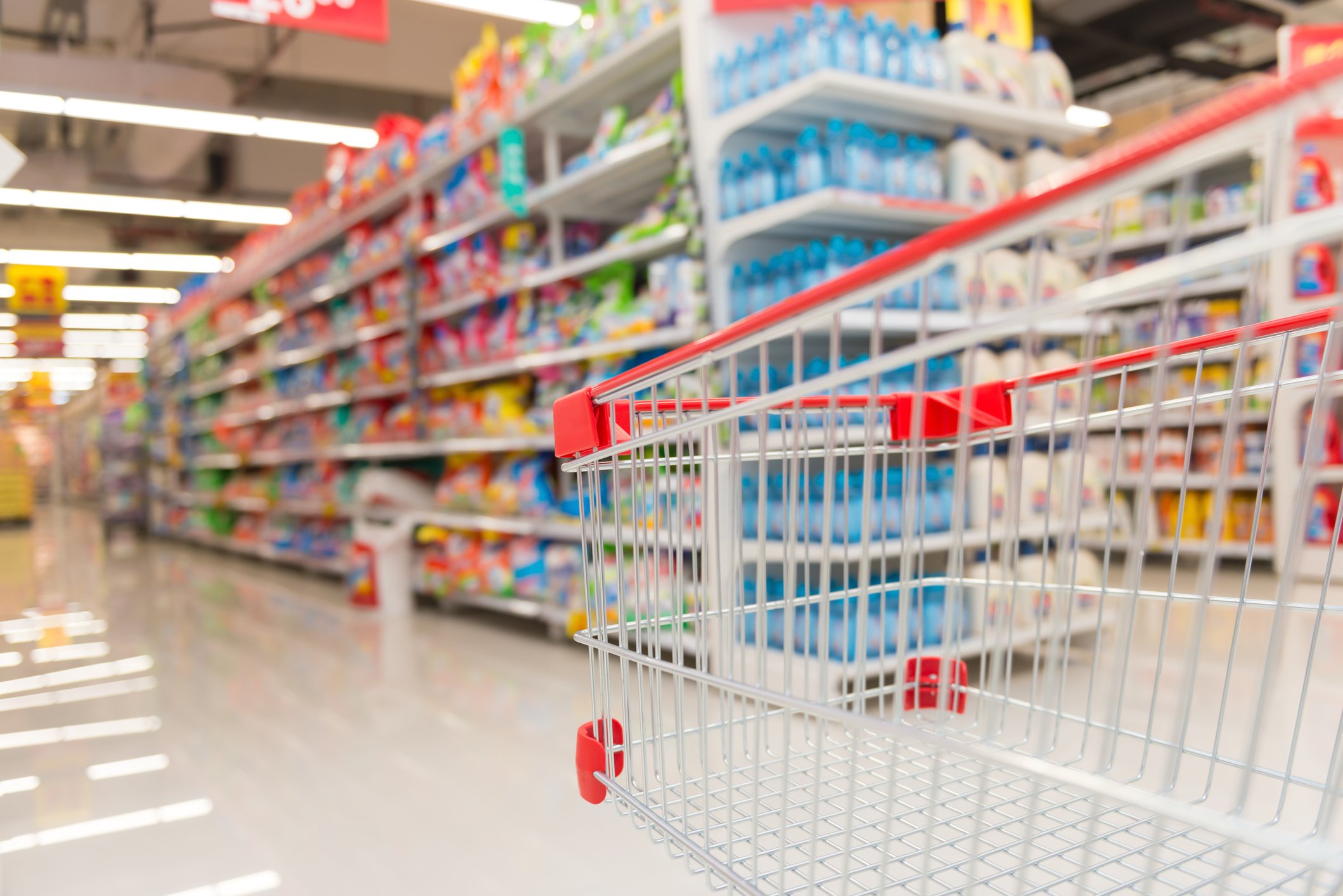 Close-up of a shopping cart in a dollar store.