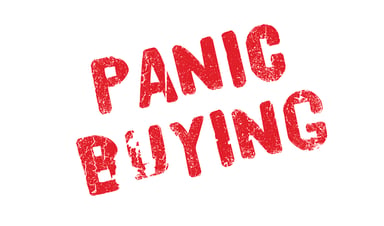 Word PANIC BUYING stamped in red ink