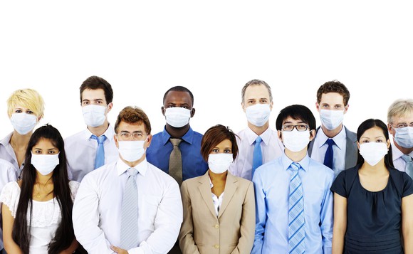 Group of people wearing surgical masks.