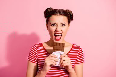 girl excited about eating a chcolate bar