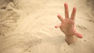 Hand in quicksand