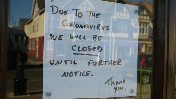 Business closed sign in a window. 