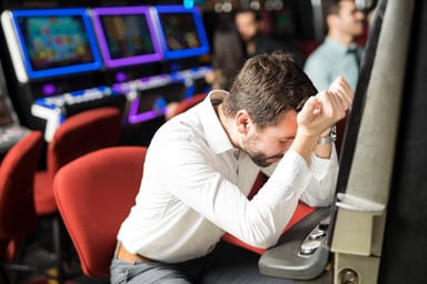 Unhappy man at slot machine
