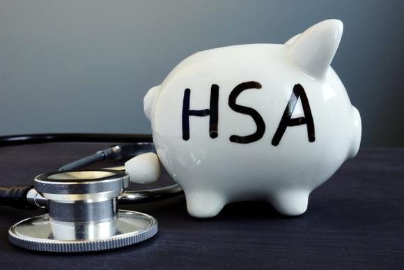 White piggy bank with HSA written on it in black