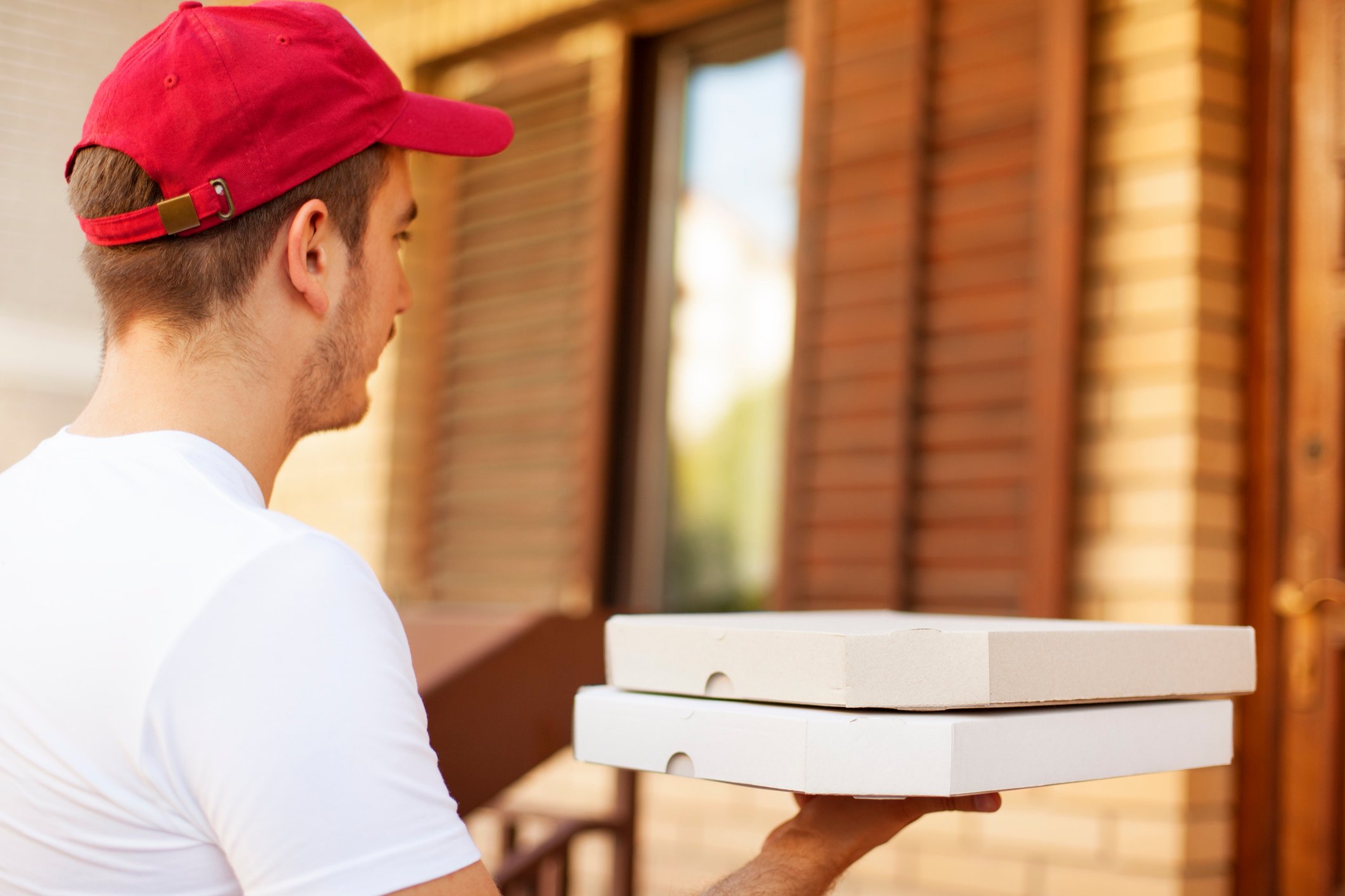 A pizza delivery person.
