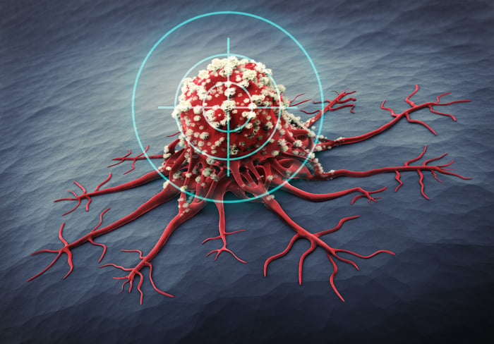 A target hovers over a spreading cancer cell.