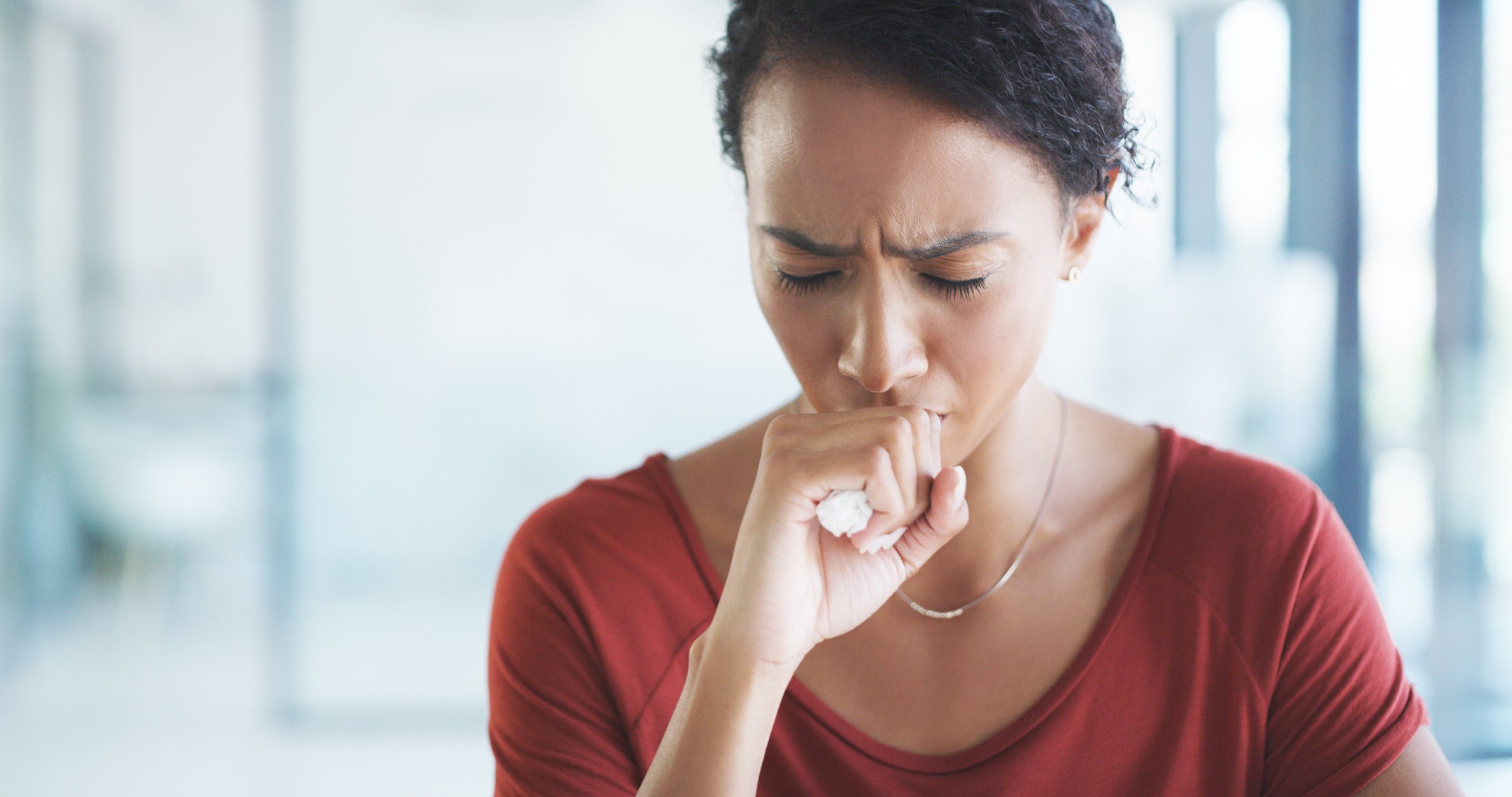 Woman coughing.