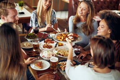 Friends Sharing Dinner in a Restaurant