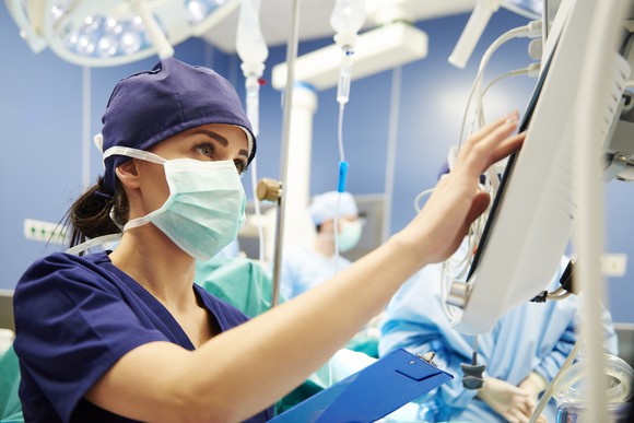 A nurse working in a hospital operating room.