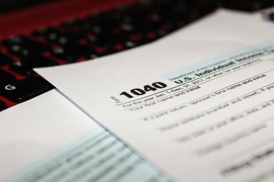 tax form 1040 on keyboard_GettyImages-919004136
