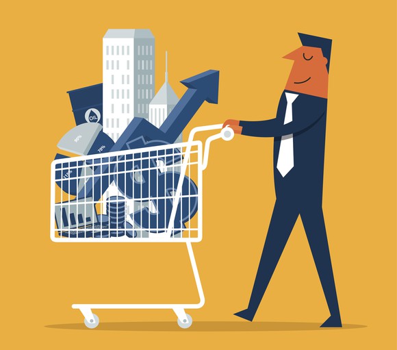 An investor pushing a shopping cart filled with good deals.