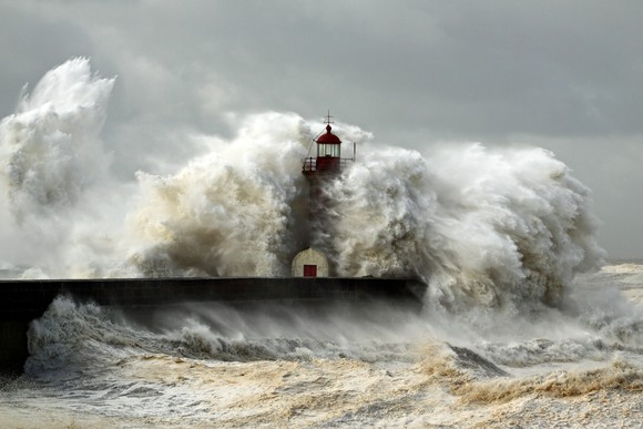 Lighthouse being battered by rough seas