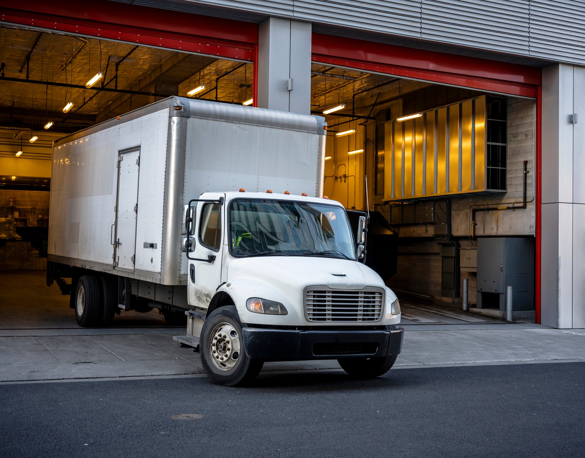 Box truck pulling out of a warehouse